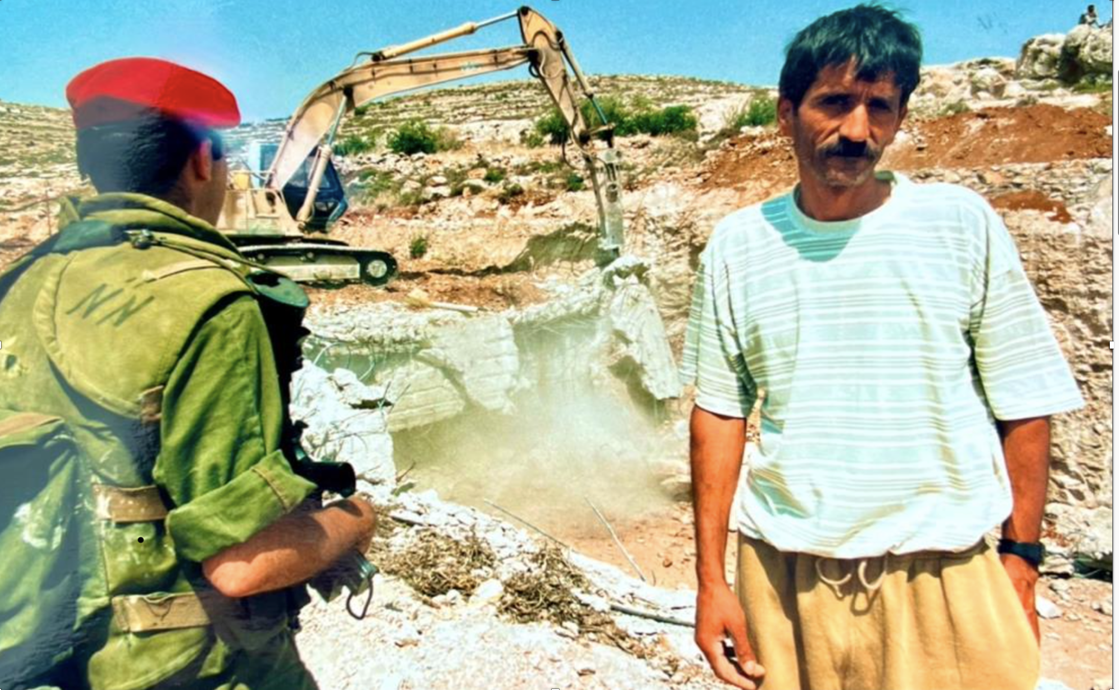 Atta watching a soldier digger on his land
